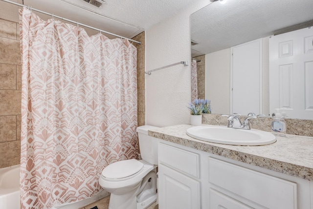 full bathroom featuring shower / tub combo with curtain, vanity, a textured ceiling, and toilet