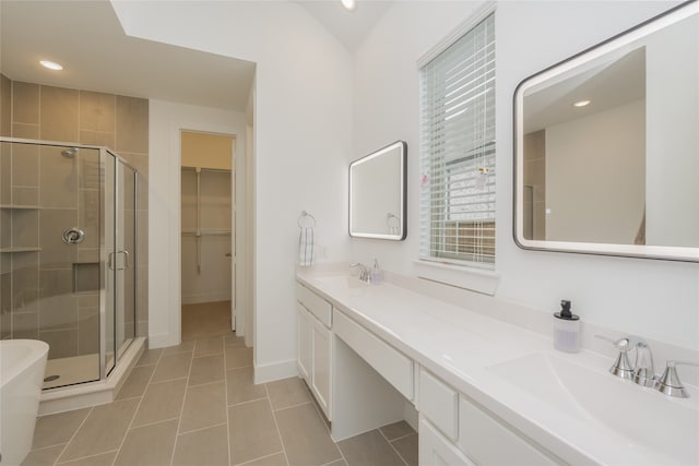 9415 Royal Forest Dr, Oak Point, TX 75068 - full bath with a stall shower, double vanity, tile patterned flooring, a walk in closet, and recessed lighting