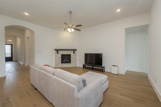9415 Royal Forest Dr, Oak Point, TX 75068 - living room featuring arched walkways, light wood-style floors, ceiling fan, recessed lighting, and baseboards