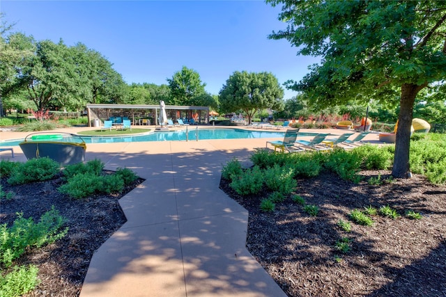 9415 Royal Forest Dr, Oak Point, TX 75068 - community pool with a patio and view of wooded area