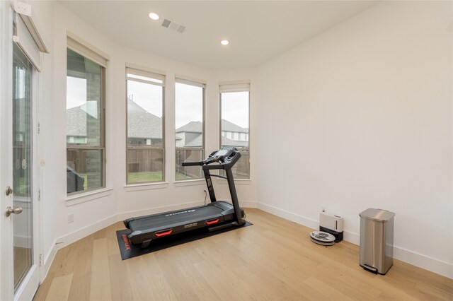 9415 Royal Forest Dr, Oak Point, TX 75068 - workout room with wood finished floors, baseboards, and recessed lighting
