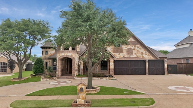 1206 Genesis Dr, Mansfield, TX 76063 - view of front facade with driveway, brick siding, stone siding, and an attached garage