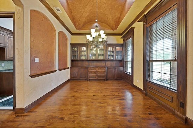 1206 Genesis Dr, Mansfield, TX 76063 - unfurnished dining area with a chandelier, dark wood-style flooring, a raised ceiling, a textured wall, and ornamental molding