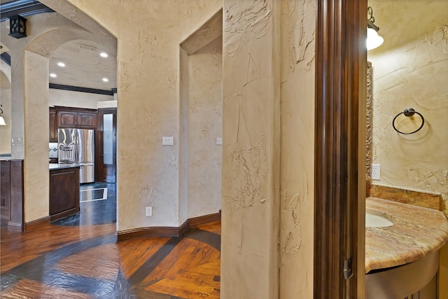 1206 Genesis Dr, Mansfield, TX 76063 - bathroom featuring wood finished floors, baseboards, a textured wall, and vanity