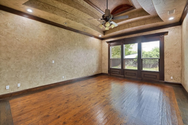 1206 Genesis Dr, Mansfield, TX 76063 - unfurnished room featuring a ceiling fan, baseboards, dark wood-style flooring, visible vents, and a raised ceiling