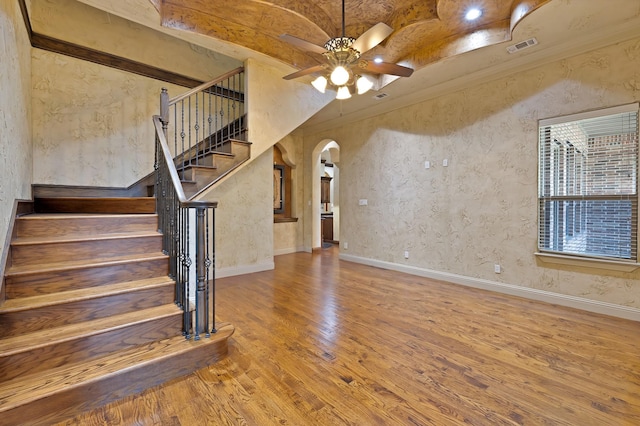 1206 Genesis Dr, Mansfield, TX 76063 - interior space featuring a ceiling fan, baseboards, arched walkways, and wood finished floors