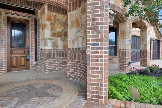 1206 Genesis Dr, Mansfield, TX 76063 - entrance to property with stone siding and brick siding