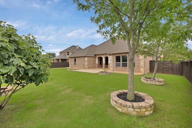1206 Genesis Dr, Mansfield, TX 76063 - view of yard featuring an outdoor fire pit, a patio area, and a gate