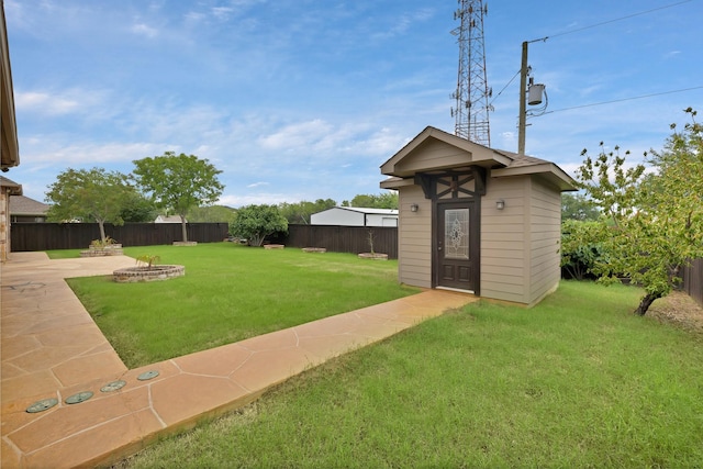 1206 Genesis Dr, Mansfield, TX 76063 - view of yard featuring a fire pit and an outbuilding