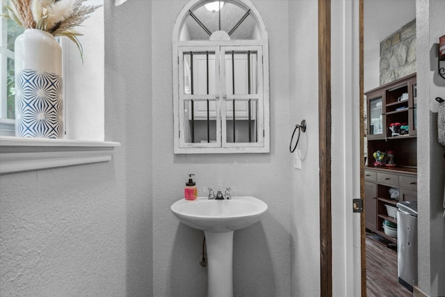 200 County Road 1574, Alba, TX 75410 - bathroom featuring wood finished floors and a textured wall