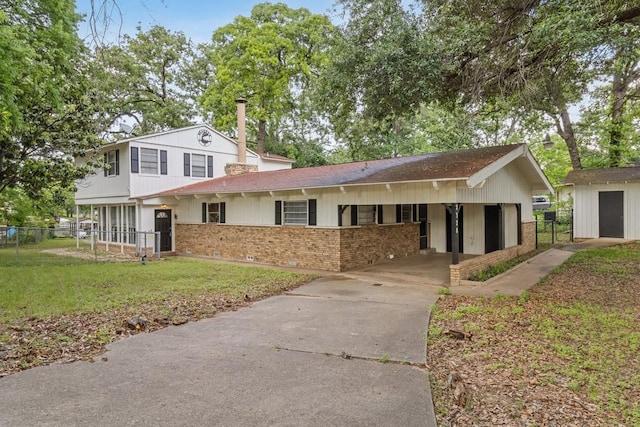 2328 Wildwood Way, Tool, TX 75143 - view of front of property featuring brick siding, concrete driveway, roof with shingles, and an attached carport