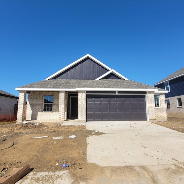 3117 Harmony Way, Cleburne, TX 76033 - view of front of home featuring driveway, brick siding, and an attached garage