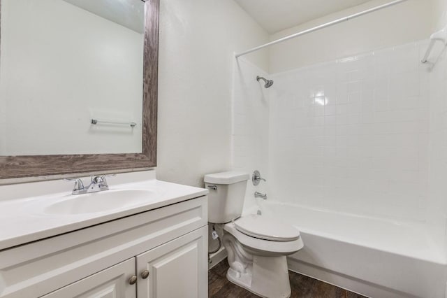 2210 Sheriff Dr, Grand Prairie, TX 75051 - full bathroom with toilet, vanity, wood finished floors, and shower / washtub combination