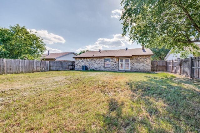 2210 Sheriff Dr, Grand Prairie, TX 75051 - view of yard with french doors and cooling unit