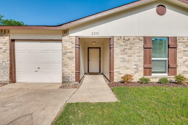 2210 Sheriff Dr, Grand Prairie, TX 75051 - view of front of home with brick siding, an attached garage, driveway, and a front yard
