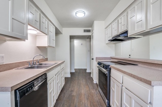 2210 Sheriff Dr, Grand Prairie, TX 75051 - kitchen with electric stove, black dishwasher, a sink, under cabinet range hood, and dark wood-style floors