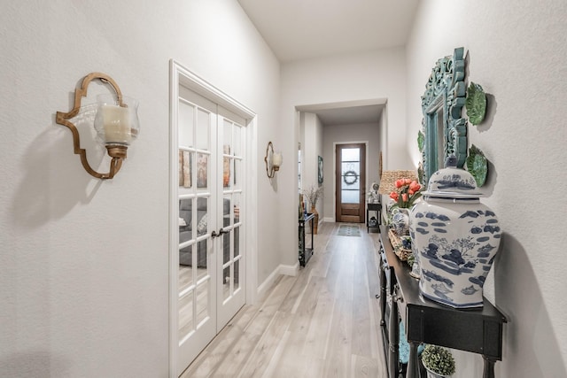 1076 Fleetwood Dr, Justin, TX 76247 - hall with french doors, light wood-style floors, and baseboards