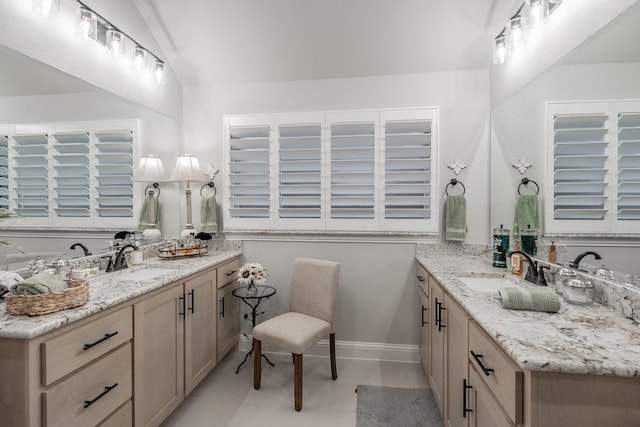 1076 Fleetwood Dr, Justin, TX 76247 - full bathroom featuring vaulted ceiling and two vanities