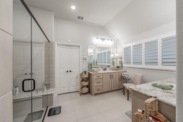1076 Fleetwood Dr, Justin, TX 76247 - bathroom with ensuite bathroom, a shower stall, vanity, vaulted ceiling, and tile patterned floors