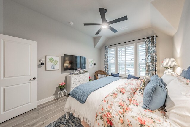 1076 Fleetwood Dr, Justin, TX 76247 - bedroom with light wood finished floors, vaulted ceiling, baseboards, and ceiling fan