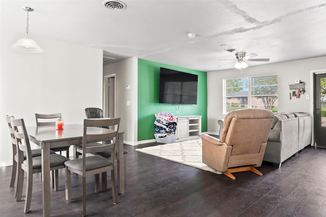3100 Karla, Mesquite, TX 75150 - dining area with dark wood-style floors, ceiling fan, and baseboards