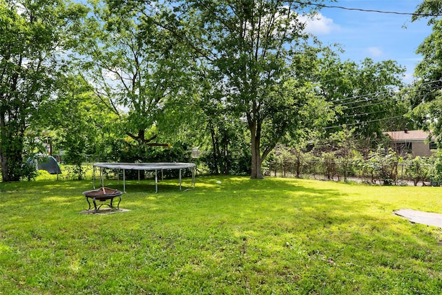 3100 Karla, Mesquite, TX 75150 - view of yard featuring a trampoline and a fire pit
