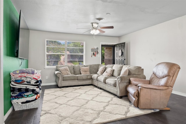 3100 Karla, Mesquite, TX 75150 - living room with baseboards, a ceiling fan, and dark wood-type flooring