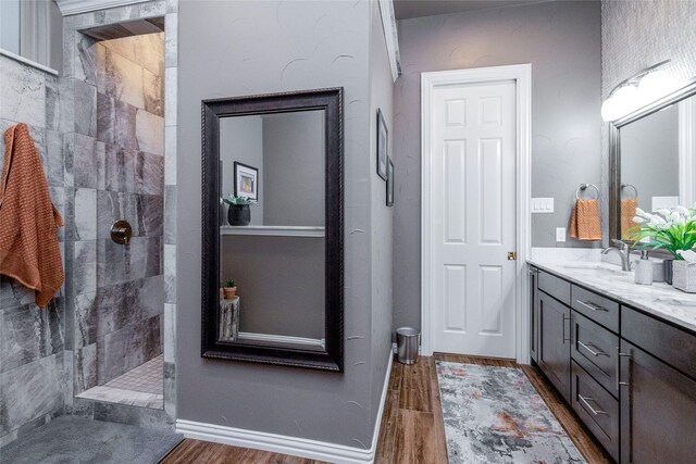 3528 Clubgate Dr, Fort Worth, TX 76137 - bathroom with a sink, a walk in shower, double vanity, and wood finished floors