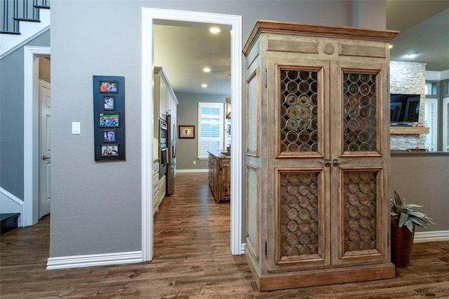 3528 Clubgate Dr, Fort Worth, TX 76137 - hall featuring dark wood-type flooring, baseboards, and stairway