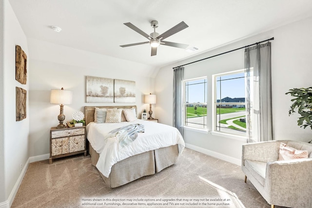 carpeted bedroom with ceiling fan, baseboards, and visible vents