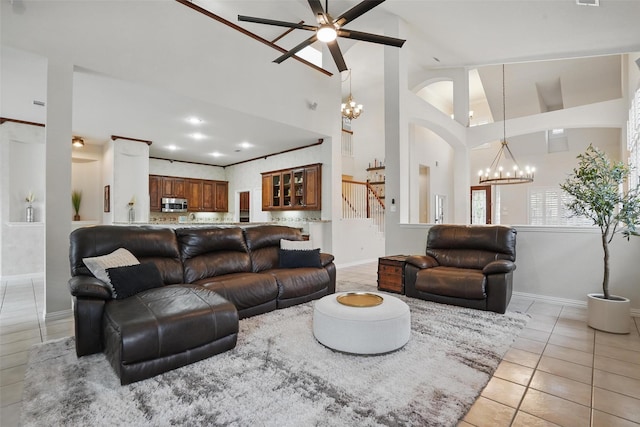 209 Odyssey Ln, Mansfield, TX 76063 - living area featuring baseboards, light tile patterned floors, high vaulted ceiling, and ceiling fan with notable chandelier