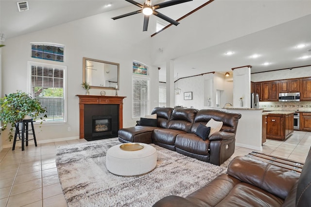 209 Odyssey Ln, Mansfield, TX 76063 - living room featuring light tile patterned floors, visible vents, a fireplace, and ceiling fan