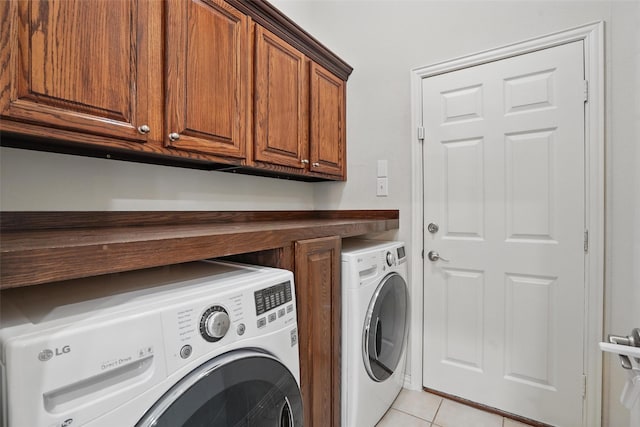 209 Odyssey Ln, Mansfield, TX 76063 - laundry area featuring washer and dryer, cabinet space, and light tile patterned floors
