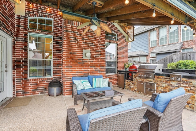 209 Odyssey Ln, Mansfield, TX 76063 - view of patio with fence, exterior kitchen, grilling area, a ceiling fan, and an outdoor hangout area