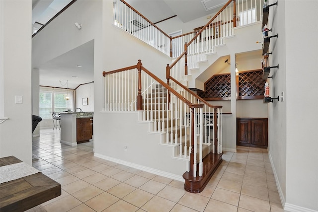 209 Odyssey Ln, Mansfield, TX 76063 - stairs featuring baseboards, tile patterned flooring, and a high ceiling