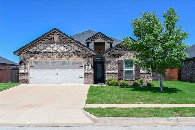 250 Martis Way, Abilene, TX 79602 - view of front of property featuring brick siding, fence, a garage, concrete driveway, and a front yard