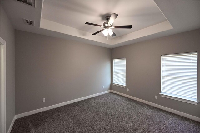 250 Martis Way, Abilene, TX 79602 - empty room with a ceiling fan, baseboards, a tray ceiling, and visible vents