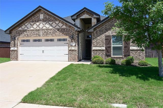 250 Martis Way, Abilene, TX 79602 - view of front of property with an attached garage, a front lawn, brick siding, and driveway