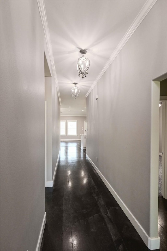 250 Martis Way, Abilene, TX 79602 - corridor featuring an inviting chandelier, ornamental molding, and baseboards