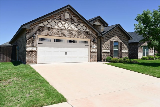250 Martis Way, Abilene, TX 79602 - view of front of home featuring concrete driveway, an attached garage, brick siding, and a front yard