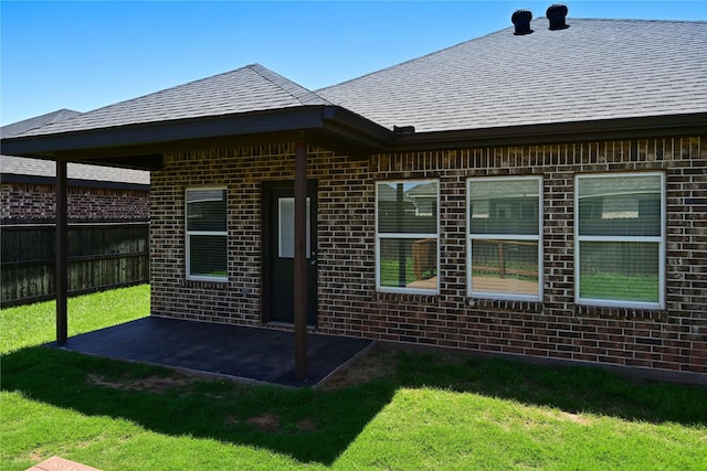 250 Martis Way, Abilene, TX 79602 - back of house featuring a lawn, a patio area, brick siding, and fence