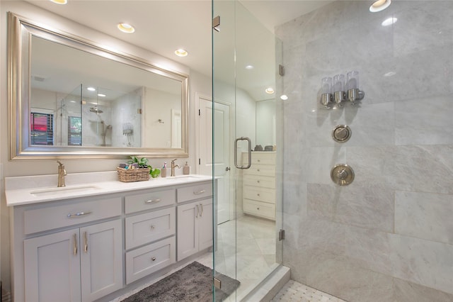 full bathroom featuring a shower stall and double vanity