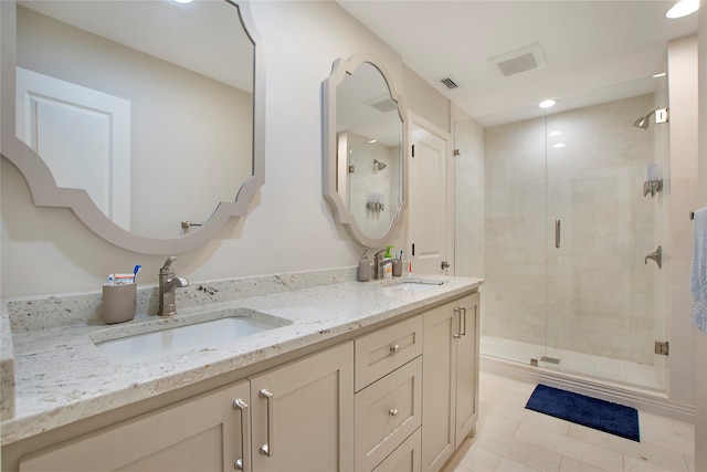 7032 Roundrock Rd, Dallas, TX 75248 - full bathroom featuring double vanity, a shower stall, and tile patterned floors