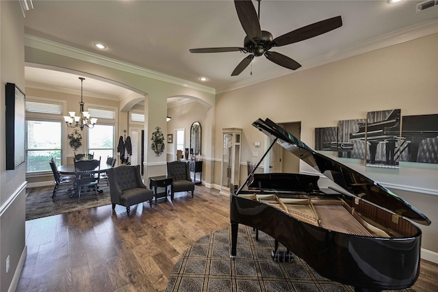 8301 Cimarron Trl, Abilene, TX 79606 - sitting room featuring wood finished floors, ceiling fan with notable chandelier, visible vents, baseboards, and arched walkways
