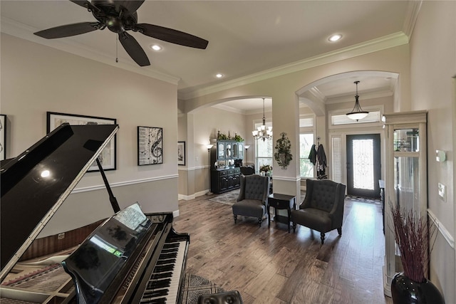 8301 Cimarron Trl, Abilene, TX 79606 - living area with crown molding, recessed lighting, arched walkways, and wood finished floors