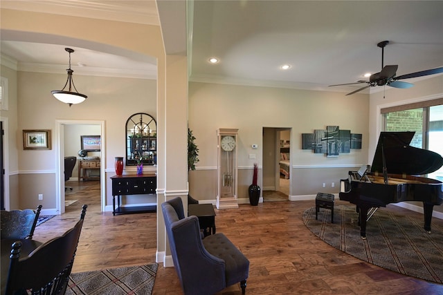 8301 Cimarron Trl, Abilene, TX 79606 - living room with crown molding, baseboards, ceiling fan, and wood finished floors