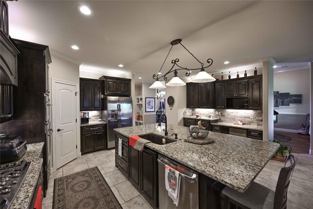8301 Cimarron Trl, Abilene, TX 79606 - kitchen with a sink, stainless steel appliances, decorative backsplash, ornamental molding, and recessed lighting