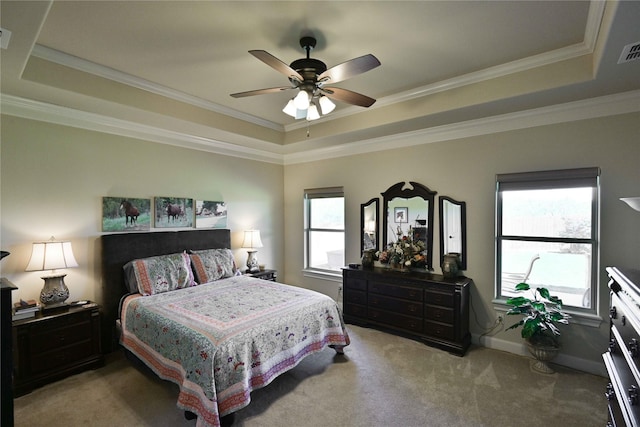 8301 Cimarron Trl, Abilene, TX 79606 - bedroom featuring a ceiling fan, ornamental molding, visible vents, a raised ceiling, and light carpet