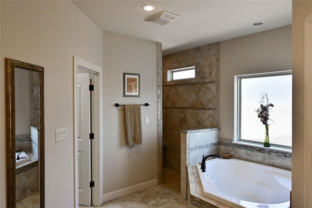 8301 Cimarron Trl, Abilene, TX 79606 - full bath featuring recessed lighting, baseboards, walk in shower, visible vents, and a garden tub