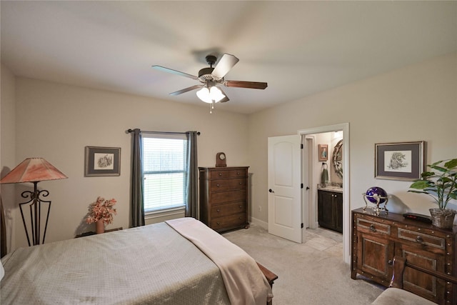 8301 Cimarron Trl, Abilene, TX 79606 - bedroom with light carpet, connected bathroom, and a ceiling fan